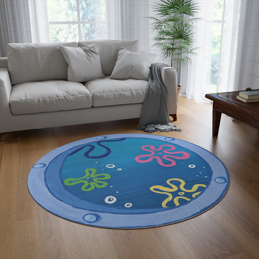 Large area rug of a blue submarine window showing rainbow flower clouds and bubbles