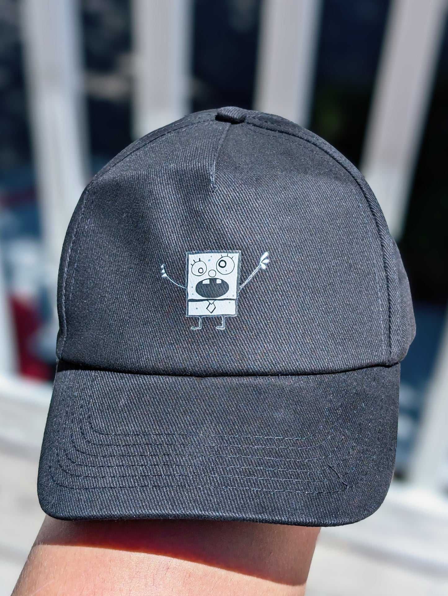 black ball cap with doodle accent