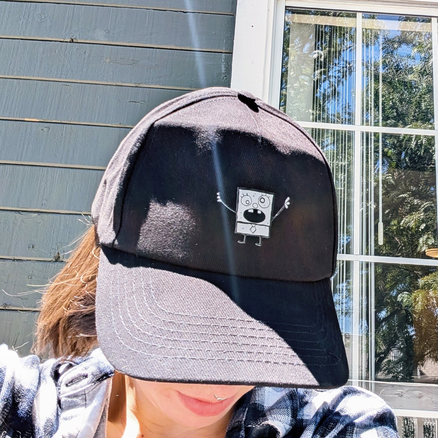 black ball cap with doodle accent