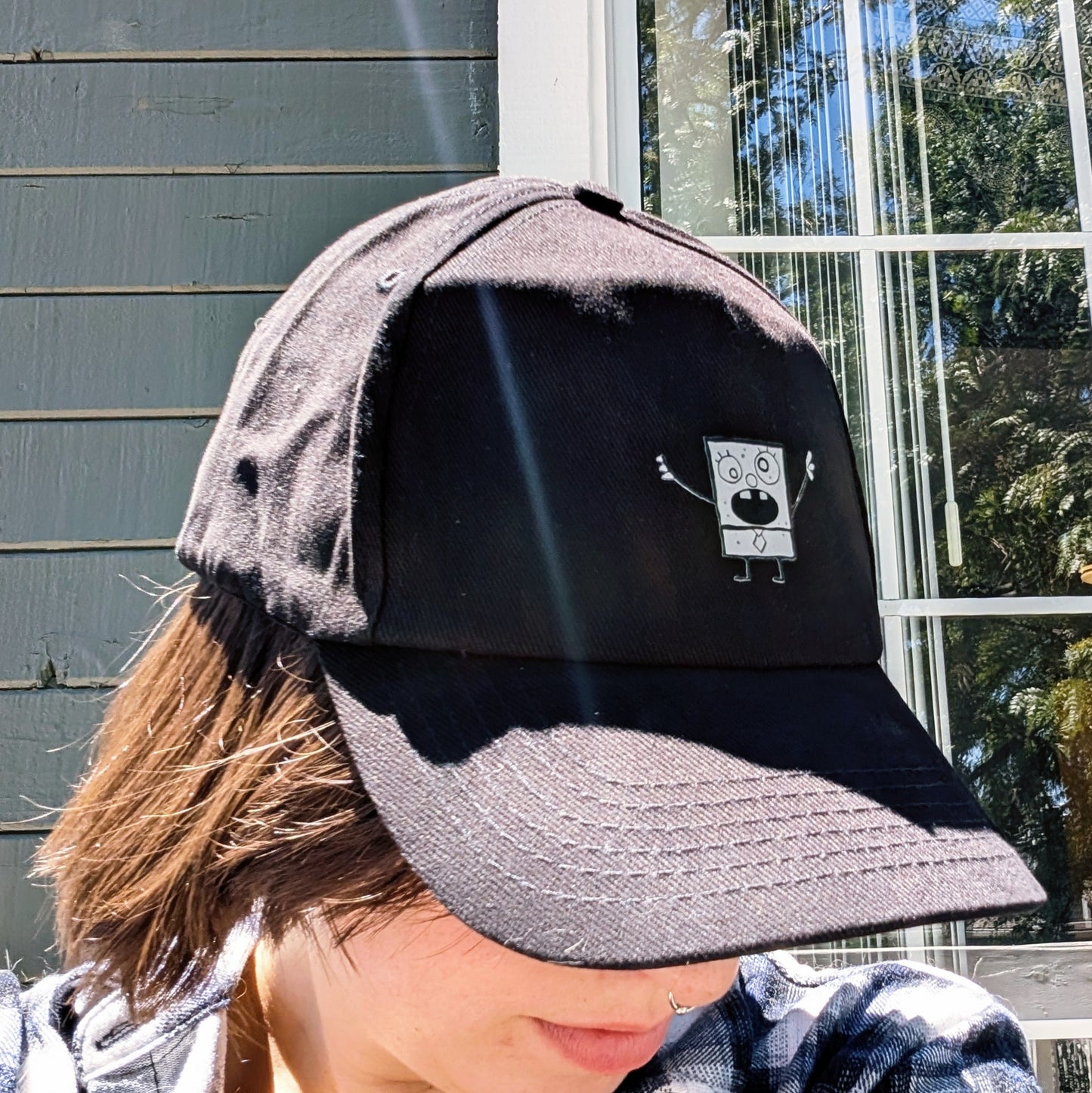 black ball cap with doodle accent