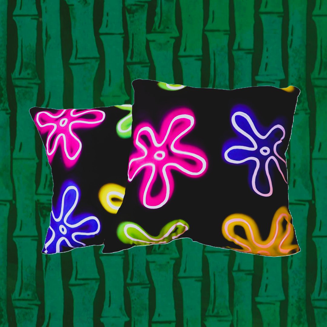 black throw pillows with abstract, large neon flower pattern, green bamboo cartoon background