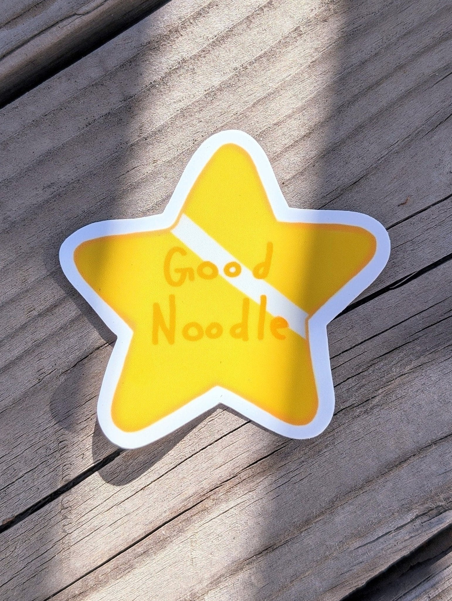 gold star sticker that says good noodle